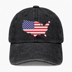 May include: A black denim baseball cap featuring an embroidered design of the United States flag in the shape of the country's outline. The flag design includes red and white stripes and a field of blue with white stars.