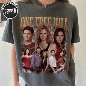 May include: A set of three ceramic nesting bowls in shades of blue, green, and white. The bowls feature a speckled glaze and a simple, modern design. The largest bowl measures approximately 7 inches in diameter.