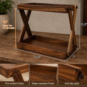 May include: A two-tier wooden storage rack with a dark brown finish, featuring X-shaped side supports. Dimensions are 37.1 cm wide, 17.8 cm deep, and 30 cm high, with 25.4 cm of clearance between tiers. Includes pre-drilled holes and anti-slip pads.