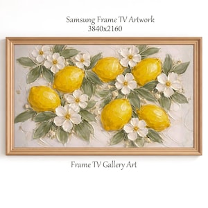 May include: A framed artwork featuring a still life of lemons and white flowers. The lemons are bright yellow, and the flowers are white with green leaves. The frame is a light gold color. Text at the top reads "Samsung Frame TV Artwork 3840x2160" and at the bottom "Frame TV Gallery Art."