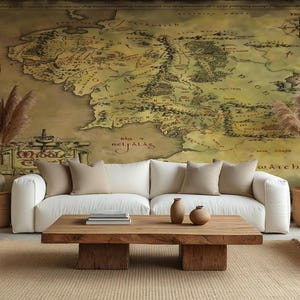 May include: A living room with a large map mural, white sofas, and a wooden coffee table. Decorative vases and dried plants add warmth. The room has a neutral color palette with a rug and pillows.