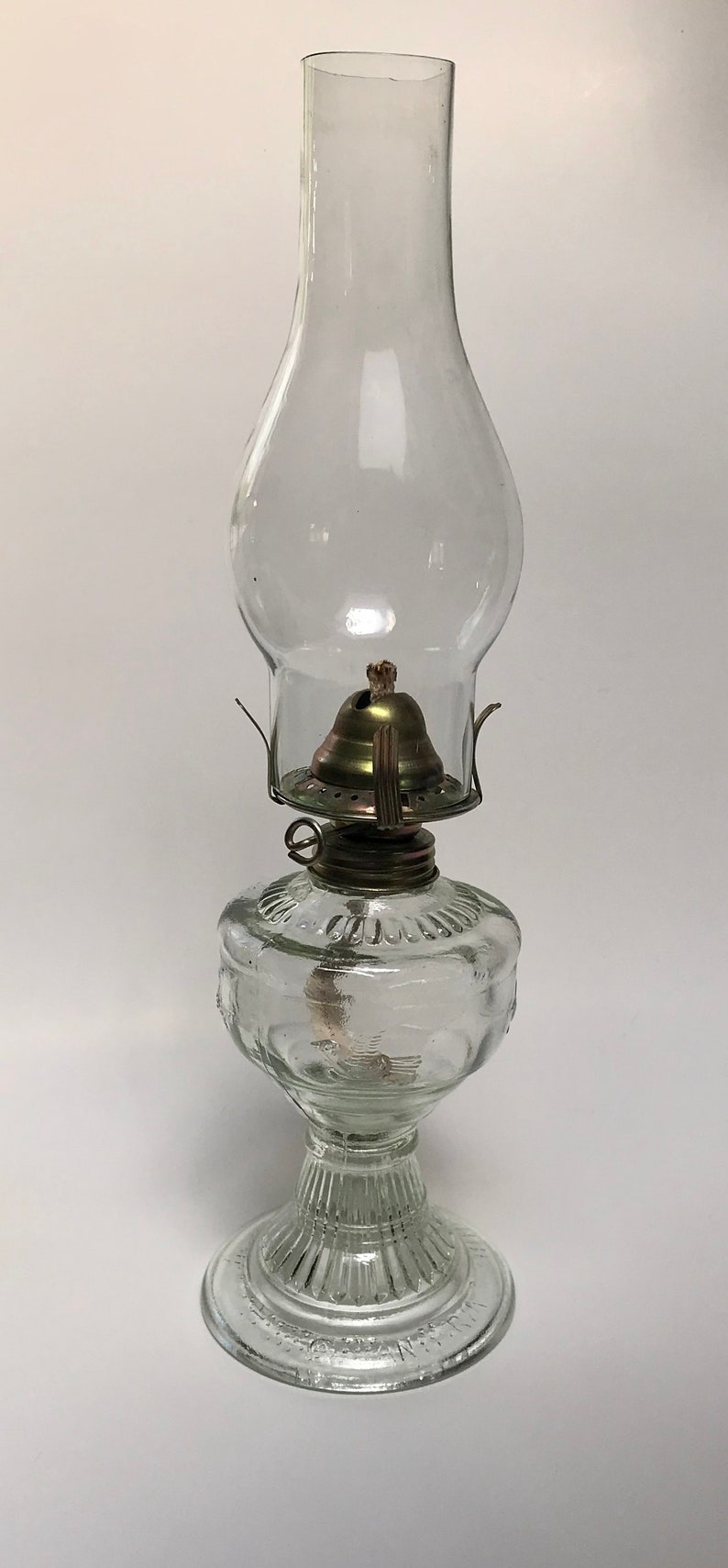 Vintage clear glass oil lamp image 1