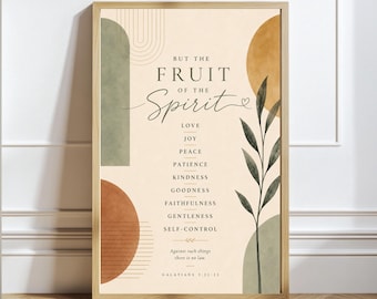 May include: A framed wall art print featuring the text "BUT THE FRUIT OF THE SPIRIT" followed by a list of virtues including love, joy, and peace. The design includes abstract geometric shapes in sage green and terracotta, and a leafy branch.