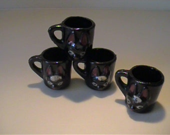 Four vintage 1950's miniature ceramic redware bunny rabbit mugs