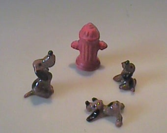 Vintage 1960's miniature Hagen Renaker three hound dogs and red fire hydrant