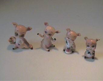 Four vintage Josef Originals miniature little pigs went to the market