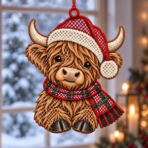 May include: A hanging ornament shaped like a Highland cow with shaggy light brown fur, wearing a red and white Santa hat and a red, green, and white plaid scarf. The cow has two curved horns, dark eyes, and dark hooves at the bottom base.