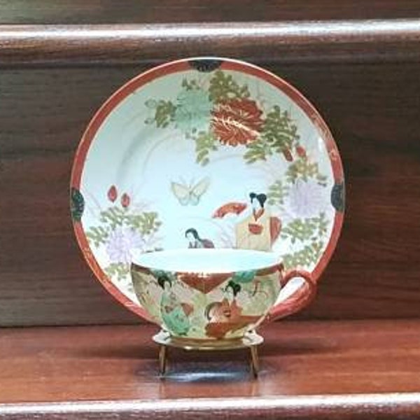 Hand-painted Asian cup and saucer set with gold display included. Free shipping