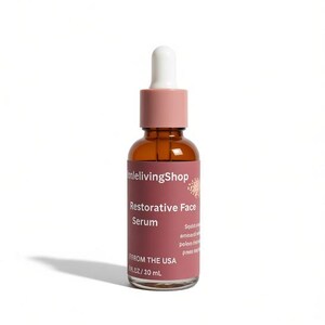 May include: A brown glass bottle of Restorative Face Serum with a white dropper and a pink cap. The label is a dark pink color and has the text "mlelivingShop", "Restorative Face Serum", and "FROM THE USA". The bottle contains 1 fl oz / 10 mL.