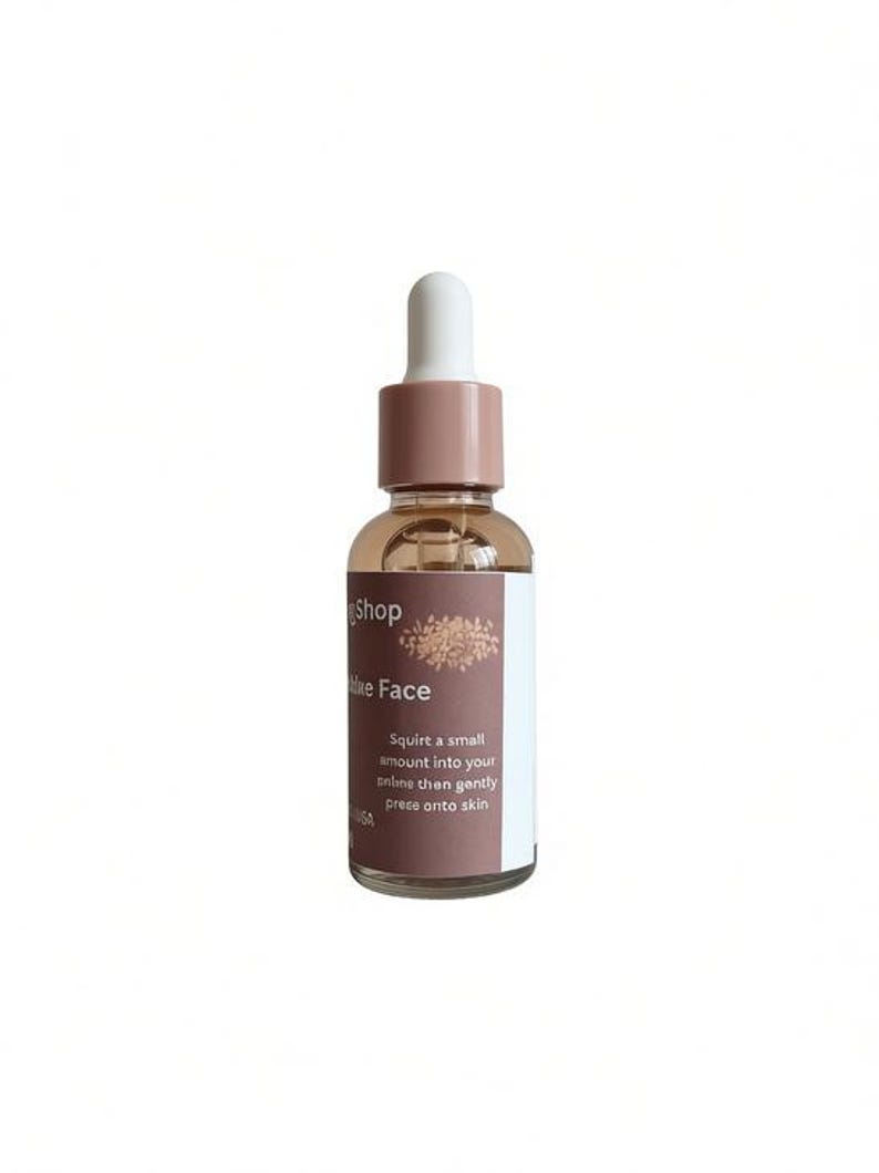 May include: A clear glass bottle with a dropper, filled with a light brown liquid. The bottle has a white and brown label with the text "Shop", "Hike Face", and instructions. The dropper top is white and brown.