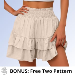 May include: A beige skirt with a high-waisted smocked elastic waistband and two horizontal ruffled tiers. The fabric has a subtle textured finish. The text at the bottom of the image reads: BONUS: Free Two Pattern.