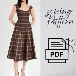 May include: A brown and tan plaid dress with a scoop neckline, cap sleeves, and a pleated skirt. The text "sewing Pattern" is written in black script above a black icon of a document with the letters "PDF" and a needle and thread heart design.
