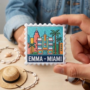 May include: Embroidered patch featuring a colorful Miami cityscape design with palm trees and buildings. The patch has a postage stamp border and the text "EMMA - MIAMI".