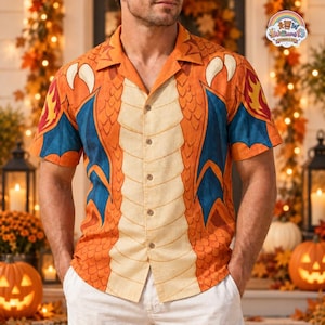 May include: A short-sleeved button-down shirt featuring a vibrant orange and blue dragon-inspired graphic print. The design includes a central cream-colored panel with horizontal lines, orange scale patterns on the sides, and blue wing motifs.