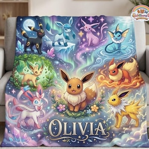 May include: A soft throw blanket featuring a colourful illustration of various Eevee evolution characters set against a cosmic, starry background with glowing lights. The name Olivia is printed in large, elegant white lettering at the bottom.