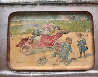 antique tin tray for child’s tea set , circa 1900.