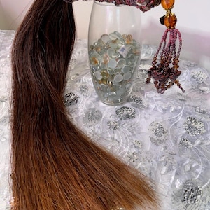 May include: A rustic wooden sign with the text "Welcome to our home" in white lettering. The sign features a distressed finish and a simple, inviting design, perfect for entryway decor.