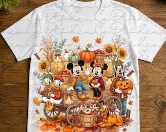 May include: A white t-shirt featuring a graphic of Mickey Mouse, Minnie Mouse, Donald Duck, Daisy Duck, Goofy, Pluto, Chip, and Dale on a wooden wagon filled with pumpkins, sunflowers, and apples, with the text Ready to press DTF Transfer.