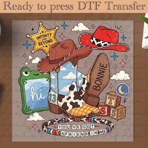 Peut inclure: Une feuille de transfert DTF illustrée avec une botte de cow-boy à motifs de vache et le chiffre 13, deux chapeaux de cow-boy, une étoile de shérif avec le texte Infinity and Beyond, une grenouille verte, des cubes et une corde perlée avec le texte You've Got A Friend In Me.
