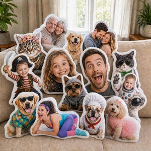 May include: A collection of custom-shaped throw pillows featuring printed photographs of people and pets. The pillows display various subjects including a child in a pirate costume, a dog in a chef outfit, a person in workout gear, and a child in an astronaut suit.