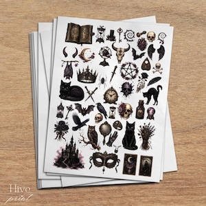 May include: A sticker sheet featuring a collection of dark, gothic-themed illustrations including black cats, skulls, a castle, an owl, ravens, bats, a crown, a pentagram, tarot cards, an hourglass, a dagger, and various mystical symbols in black and grey.