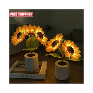 May include: A rustic wooden sign with the text "Welcome to our home" in white lettering. The sign features a distressed finish and a simple, inviting design, perfect for front door decor.