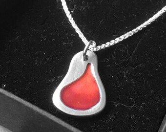 Solid silver pendant with red/orange enamel on an 18" in silver chain