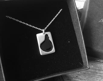Silver pendant with black enamel on an 18" silver chain