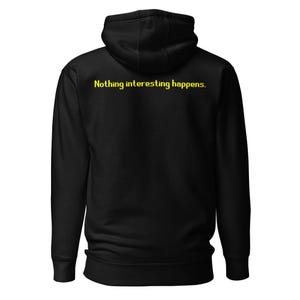 May include: Black hooded sweatshirt with the text "Nothing interesting happens" in yellow. The hoodie has a drawstring and a kangaroo pocket. The garment is made of a soft material.