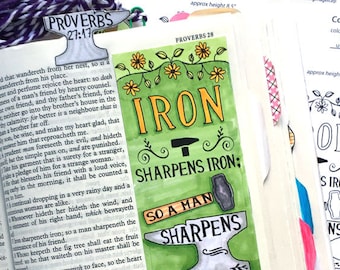 May include: A printable bookmark with a green, yellow, and black illustration of an anvil and hammer with the text "Iron sharpens iron: so a man sharpens the countenance of his friend. Proverbs 27:17".