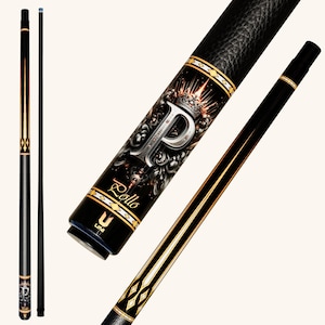 May include: A black pool cue featuring a textured grip and a decorative butt section with a large silver letter P, a crown graphic, and the text Rollo. The shaft is smooth with gold and black accents, and the cue includes a blue tip at the top.