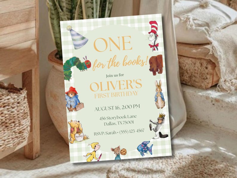 May include: A rectangular invitation card with a light green gingham border featuring watercolor illustrations of storybook characters. The text reads: ONE for the books! Join us for OLIVER'S FIRST BIRTHDAY, AUGUST 16, 2:00 PM, 456 Storybook Lane, Dallas, TX 75001, RSVP: Sarah (555) 123-4567.