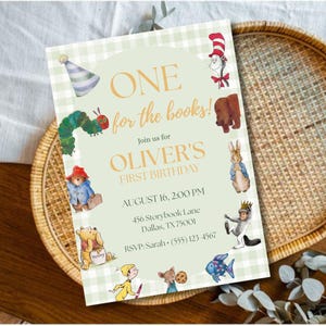 May include: A rectangular invitation card with a light green gingham border and a central pale green panel. It features illustrations of storybook characters and the text: ONE for the books! Join us for OLIVER'S FIRST BIRTHDAY, AUGUST 16, 2:00 PM.
