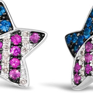 May include: A pair of star-shaped stud earrings crafted from silver-toned metal. Each earring features a cluster of blue stones at the top point, with alternating vertical stripes of pink stones and clear white stones filling the remaining surface.