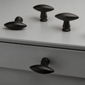 Matzwarte olijfvormige ladeknop, minimalistische kastgreep met één gat