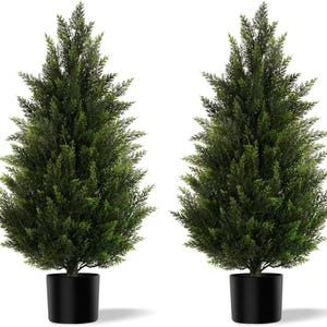 May include: Two artificial evergreen trees with dense, dark green foliage. Each tree is potted in a sleek, black cylindrical pot. The trees have a symmetrical, conical shape, suitable for indoor or outdoor decor.