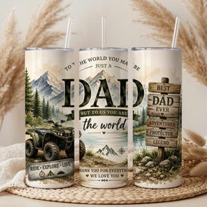 May include: Three cylindrical tumblers with clear straws featuring a mountain landscape, an olive green ATV, and wooden signposts. Text reads: To the world you may be just a dad but to us you are the world, Best Dad Ever, Adventurer, Protector, Legend.