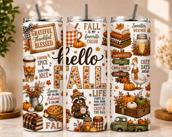 May include: Three cylindrical tumblers with straws featuring autumn-themed graphics. Designs include pumpkins, a raccoon, a goose, stacked sweaters, and text such as Grateful Thankful Blessed, Hello Fall, and Sweater Weather in orange, brown, and green tones.