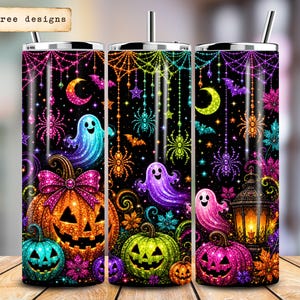 May include: Three cylindrical tumblers with straws featuring a black background and neon Halloween patterns including jack-o'-lanterns, ghosts, spiders, webs, bats, and a lantern. A small sign in the top left corner reads 30 free designs.