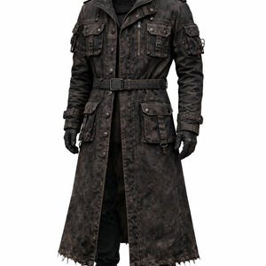 May include: A long, dark brown hooded coat with multiple pockets, a belt, and a distressed appearance. The coat features a zipper closure, buttoned pockets, and a rugged, worn aesthetic. The model is wearing black gloves and boots.