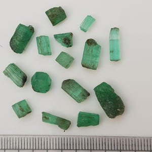 May include: A handmade wooden chopping board with a natural finish. The board has a live edge on one side and a rectangular shape. It's approx. 45 cm long and 30 cm wide.