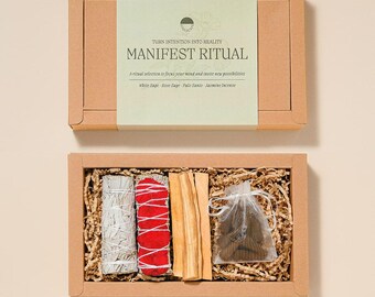 May include: A Manifest Ritual box set with a light green label and the text "TURN INTENTION INTO REALITY" and "MANIFEST RITUAL". The box contains white sage, rose sage, palo santo, and jasmine incense. The box is brown and filled with brown crinkle paper.