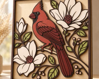 May include: A square wooden wall art piece featuring a layered, three-dimensional cutout of a red cardinal bird perched on a branch. The design includes white magnolia flowers with dark centers, green leaves, and small berries on a tan background.