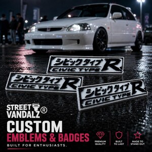 May include: Three rectangular car emblems featuring the text CIVIC TYPE R in black lettering alongside Japanese characters. The emblems have a white background with a black border and are displayed on a dark, wet surface with a white car in the background.