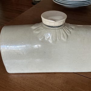 Stoneware Foot warmer Bourne Denby England with decorative molded flower surrounding the stopper