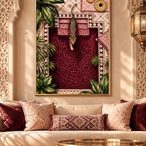 May include: A framed wall art print featuring a leopard descending stone steps into a deep red pool. The scene is surrounded by lush green tropical foliage, geometric tile patterns, and two circular gold accents on a light pink background.