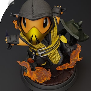 May include: A detailed figurine of a character in a yellow and black outfit with a black hood and mask. The figure is posed with a weapon in one hand and surrounded by orange flame effects. The base is dark gray.