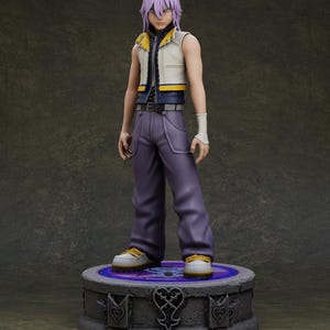 May include: A detailed figurine of a character with purple hair, wearing a white and yellow vest, purple pants, and white sneakers with yellow accents. The figure stands on a decorative pedestal with heart and key designs.