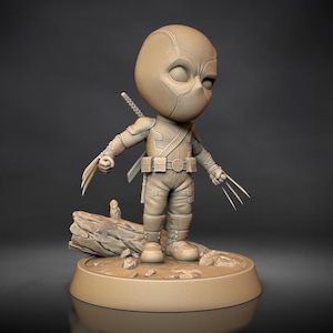 May include: A tan-colored figurine of Deadpool in a chibi style. The figure has a mask, costume, and two swords on its back. It is posed with claws extended, standing on a base with a log and rocks.