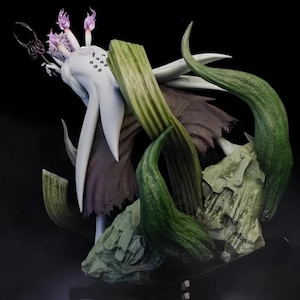 May include: A detailed figurine of a fantastical creature with a white body, purple accents, and green, textured elements. The figure has multiple flowing appendages and is set against a dark background, showcasing intricate details.